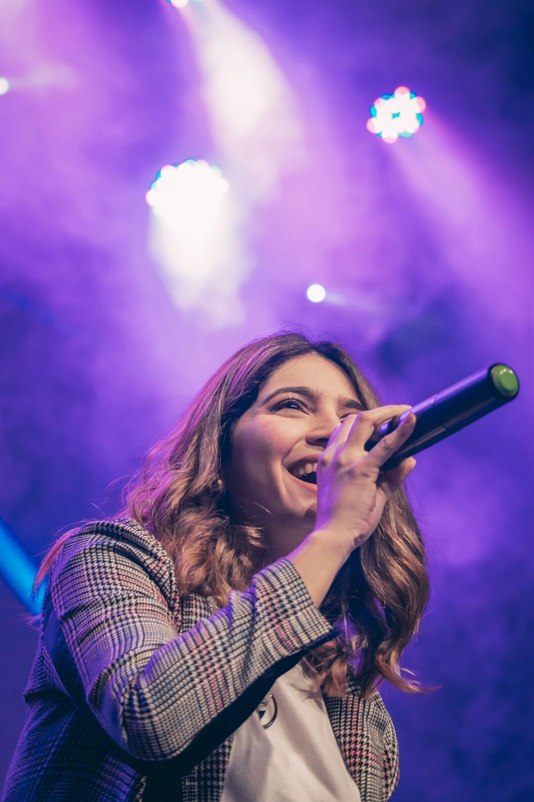 young female singer on stage