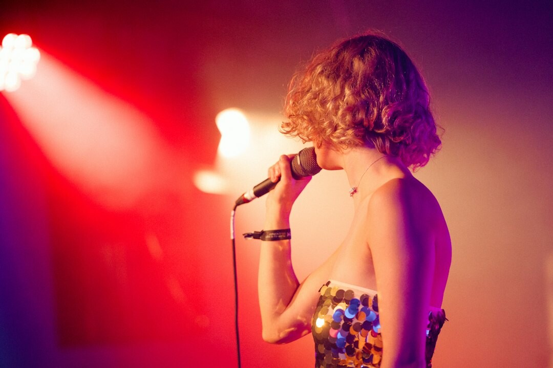 young female singer on stage